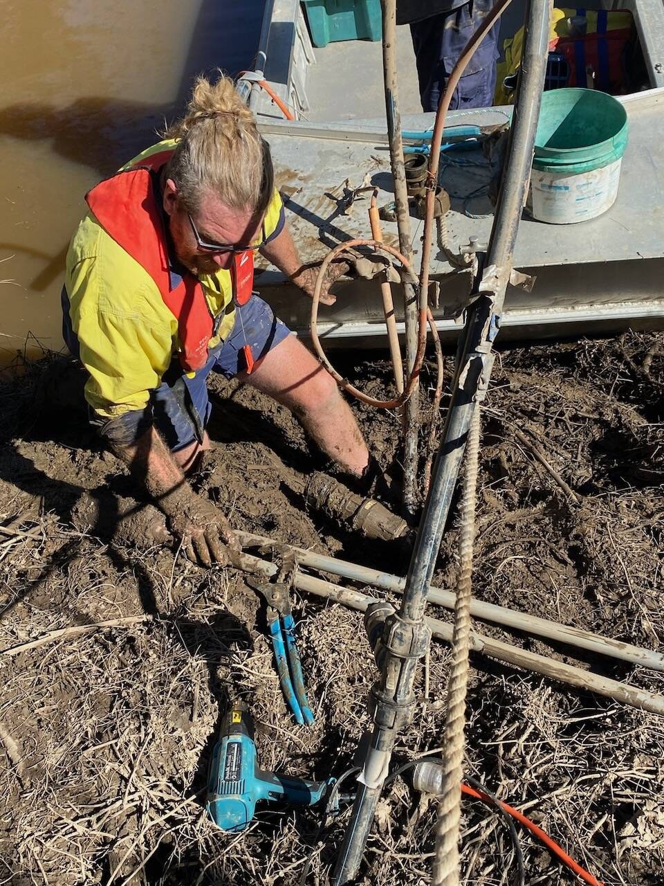 Repairing an underground pipe in a dug hole