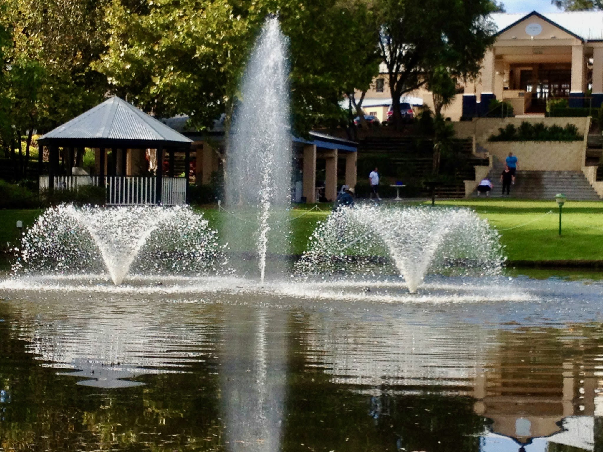 Fountain aerators running on a resort lake