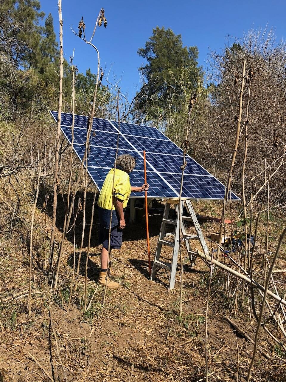 Raised solar pump array on a flood plain